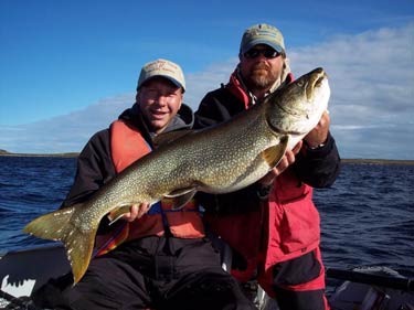 Rob Nye with angler and trout